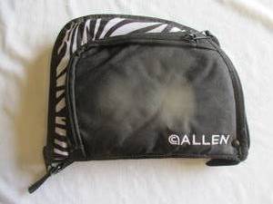 lot 74 image: ALLEN-Zebra Striped And Black Zippered Soft Sided Pistol Case And It Has A Zippered Ammo  Clip Pouch