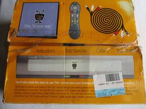 lot 90 image: THE TIVO BOX- - Tivo TV Your Way In A Box, Including Instructions, Remote, Cables ANd TIVO DVR.