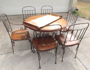 lot 121 image: Solid oak and wrought iron dining table & chair set (6 chairs) with leaf