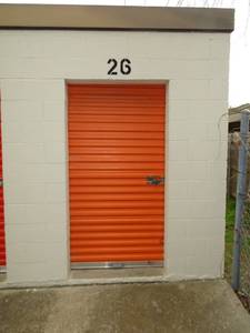 lot 121 image: UNIT A26 - 6 X 10 FILLED WITH MOTORCYCLE FRAMES, ENGINES, AND PARTS - SEE NOTE