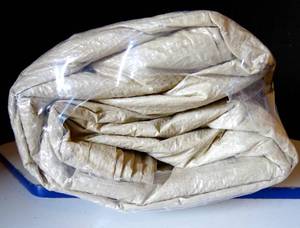 lot 151 image: LARGE BEIGE TARP AS SHOWN - UNKNOWN SIZE (WRAPPED)