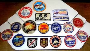 lot 184 image: NICE ASSORTMENT OD IRON ONSEW ON BADGES AND STICKERS AS SHOWN
