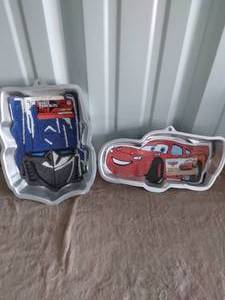 lot 15 image: Selection of 2 Wilton Cake Pans-Transformers and Lightning McQueen