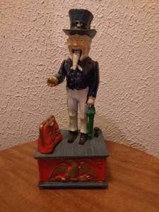 lot 89 image: Vintage Cast Iron Uncle Sam Mechanical Coin Bank--Missing Rubber Stopper in Bottom