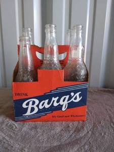lot 94 image: Vintage 6 Pack Barqs Rootbeer Bottles and Holder