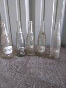 lot 96 image: 5 Vintage Nesbitts Soda Bottles--10oz