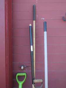 lot 16 image: Large leaf rakes qty 2, large shovel, pitch fork