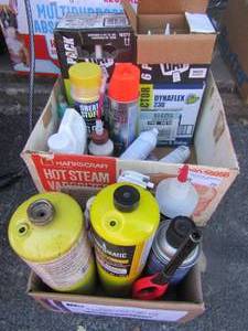 lot 26 image: 1 new and 1 used box of dinaflex CAULK  qty 10 tubes, benx o matic propane tanks small qty 2, various other items