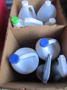lot 29 image: new and used lot of vinegar, bleach, lemon ammonia cleaner,