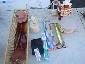 lot 38 image: Various bathroom items such as new tooth brushes, combs, candle, Christmas soap dish and more