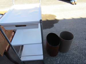 lot 47 image: 2 small bathroom waste baskets, rolling microwave cart with 1 drawer and 1 handle