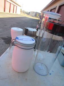 lot 53 image: Covered kitchen canisters for flour- sugar- beans -or rice, hand coffee grinder