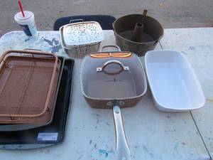 lot 71 image: Baking pans, white casserole dish, Bundt cake pan, copper chef pan with lid, metal basket strainer