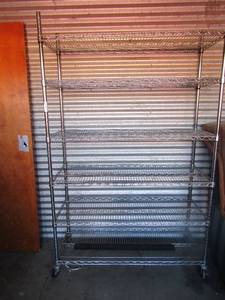 lot 73 image: METRO RACK - 764718 metal metro shelving unit, 6 tier shelves, has 4 wheels for easy movement