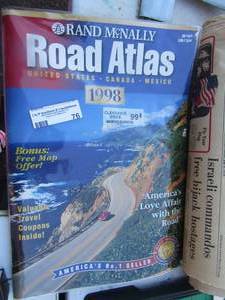 lot 76 image: 1998 road atlas by Rand McNally, July 4th 1976 Dallas morning news paper in mint condition, head line reads, Israeli commandos free Hi-Jack hostages