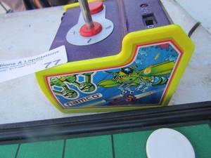 lot 77 image: Namco hand help game system thsat hooks to tv, poker chips, cards of all kinds not sure if all are there
