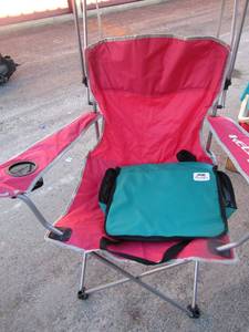 lot 83 image: red folding camping or picnic chair with built in umbrella cover, used but lots of life left, no bag to store or carry