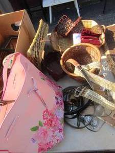 lot 101 image: various size wicker baskets used for dcor, various belts and a pink floral dcor bag