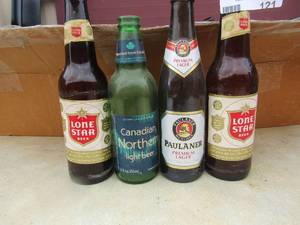 lot 121 image: large lot of vintage glass beer bottles from the 1900s all kinds of brands includes lone star,paulaner, canadian northern and many more