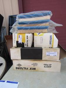 lot 130 image: 2 wix air filters for a ford, 4 napa gold wix oil filters, 3 air filter for a forklift