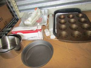 lot 143 image: kitchen lot includes a gtc electric carving knife nib, muffin pans, pie pans, aluminum pans, plastic dish tray
