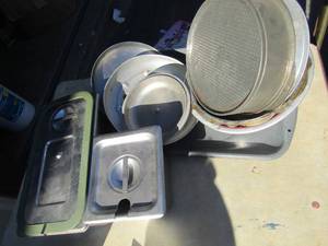 lot 154 image: Steam pans with lids, alluminum strainer, broiler pan, various lids