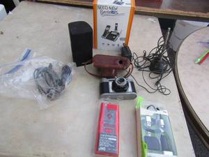 lot 210 image: Cell phone charger plus box for house and car part NIB, Marshmellow remote ear buds NIB, small Bose computer speaker, AT&T wireless home phone set used needs batteries