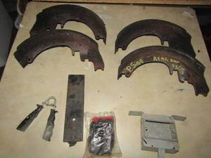 lot 215 image: Set of 4 brake shoes for a 99 year model pick up truck, front and rear