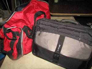 lot 222 image: Red athletics bag, has a small sleeping bag inside and a pink sports bag, 2 black office  computer bags like new