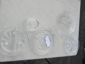 lot 241 image: Clear glass lot, covered candy dish, divided saucers, glass plates, clear glass creamer dish