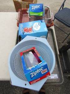 lot 252 image: Anchor hawking oven pan with wicker holder, used packs of zip loc bags, blue strainer, cookie sheet and place mats