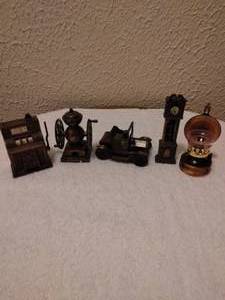 lot 48 image: Set of 5 Vintage Die Cast Pencil Sharpeners--Including Slot Machine, Grandfather Clock, Model T Ford, Coffee Grinder and Kerosene Lamp--Kerosene Lamp is missing top piece--5x the money