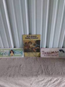 lot 91 image: Lot of 3 Vintage Metal Signs--Clover Leaf, Thelma, and B.T. Jones Baby Powder