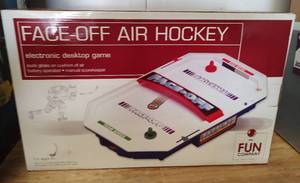 lot 35 image: FACE-OFF ELECTRONIC DESKTOP HOCKEY GAME IN BOX AS SHOWN.