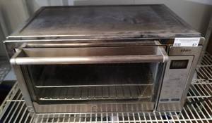 lot 67 image: OSTER TOASTER OVEN MODEL TSSTTVXLDG-003 AS SHOWN.