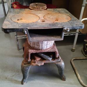 lot 74 image: VINTAGE CAST IRON COOKING STOVE NO. 228 AS SHOWN.