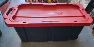 lot 169 image: HUSKY 45 GALLON LATCH AND STACK TOTE WITH WHEELS AS SHOWN.