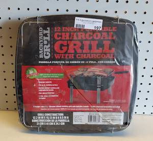 lot 197 image: 12 INCH PORTABLE CHARCOAL GRILL IN PACKAGE AS SHOWN.