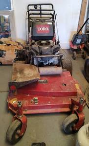 lot 200 image: TORO MID-SIZE WALK-BEHIND 36 INCH FIXED DECK GEAR DRIVE T-BAR 39674 AS SHOWN. ACCORDING TO SELLER, IT NEEDS THE PULL CORD.