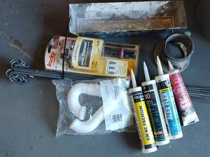 lot 259 image: CAULKING, PLUMBING SUPPLIES AND MORE AS SHOWN.