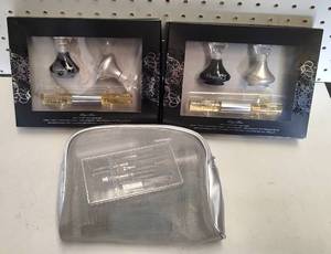 lot 300 image: (2) OUTSPOKEN PERFUME SETS AND COSMETIC TRAVEL BAG AS SHOWN.