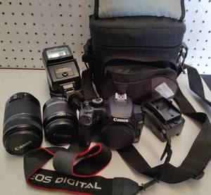 lot 372 image: CANON REBEL XS WITH TWO LENSES, FLASH, CHARGER AND BAG AS SHOWN.
