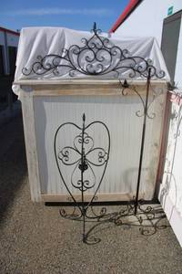 lot 9 image: Metal Decorative Pieces Wrought iron floor candelabra, cross (needs some TLC), 3-way hanging planter, metal wall dcor with swirls