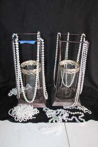 lot 266 image: Wrought iron vase holders, clear glass vases and beads