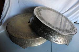 lot 142 image: Wedding Cake Stands - 22 round x 7 tall, (1) silver (1) gold