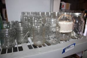 lot 143 image: Clear Mason jars and Jelly jars as shown