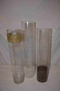 lot 100 image: Mixed Clear Glass Vases - (5) 4W x 18 Tall, (3) 4 W x 20 Tall as shown