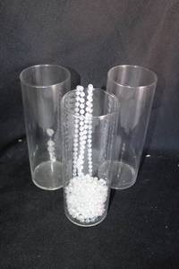 lot 295 image: (24) Clear round vases - 3.5x10 includes beads
