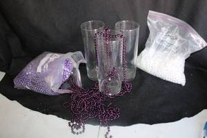 lot 294 image: (35) Clear round vases - 3x9 plus purple and white beads