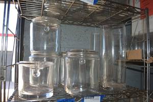 lot 299 image: Clear lidded jars and vases